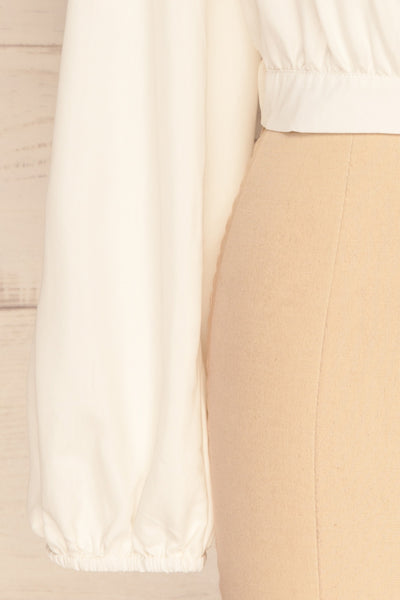 Dakovo White Long Sleeved Wrap Top | La Petite Garçonne bottom close-up