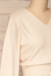 Daryna Beige Puff Sleeved Peplum Knit Top | La Petite Garçonne side close-up