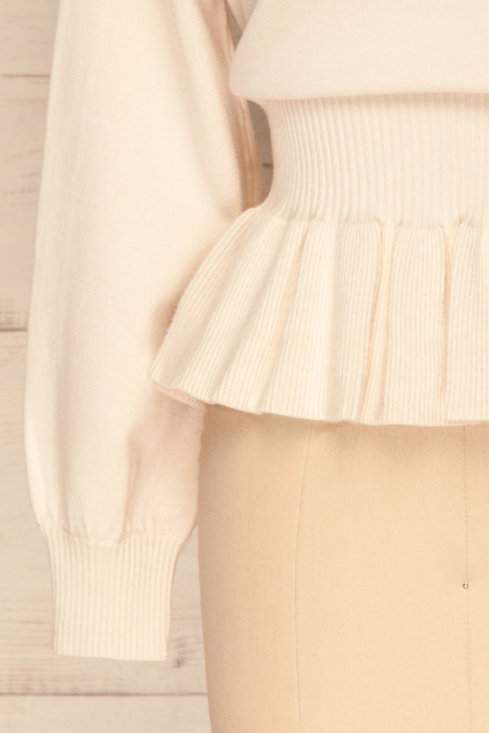 Daryna Beige Puff Sleeved Peplum Knit Top | La Petite Garçonne bottom close-up