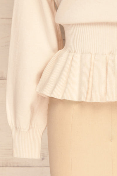 Daryna Beige Puff Sleeved Peplum Knit Top | La Petite Garçonne bottom close-up