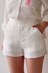Dunedin White High-Waisted Textured Shorts | La petite garçonne on model