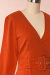 Ellesmere Orange Long Sleeved Midi Dress side close up | Boutique 1861