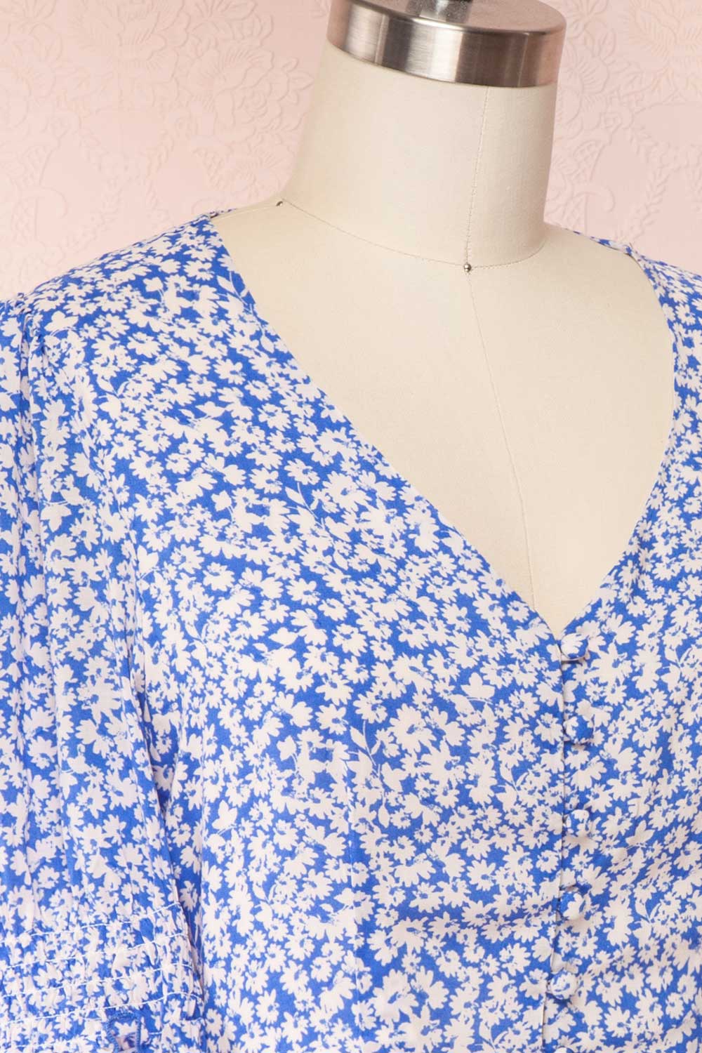 Elsie Sky Blue Floral Short Sleeved Romper side close up | Boutique 1861