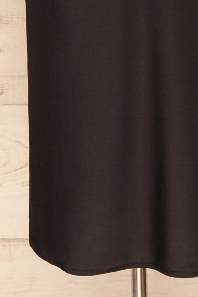 Enea Black Satin Midi Slip Cocktail Dress | La Petite Garçonne bottom close-up