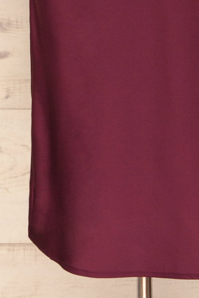 Enea Burgundy Satin Midi Slip Cocktail Dress | La Petite Garçonne bottom close-up
