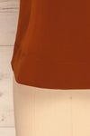 Fallet Rust Brown Boxy Short Sleeved Top | La Petite Garçonne bottom close-up