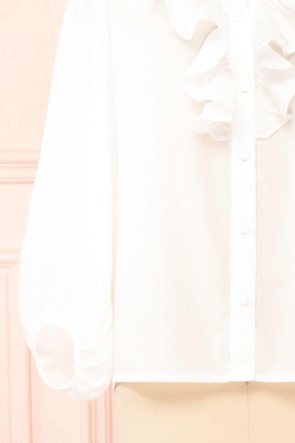 Felicie White Long Sleeve Blouse w/ Ruffle Collar | Boutique 1861 bottom close-up