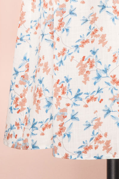 Frieda White Floral Short Sleeve Midi Dress | Boutique 1861 bottom close-up
