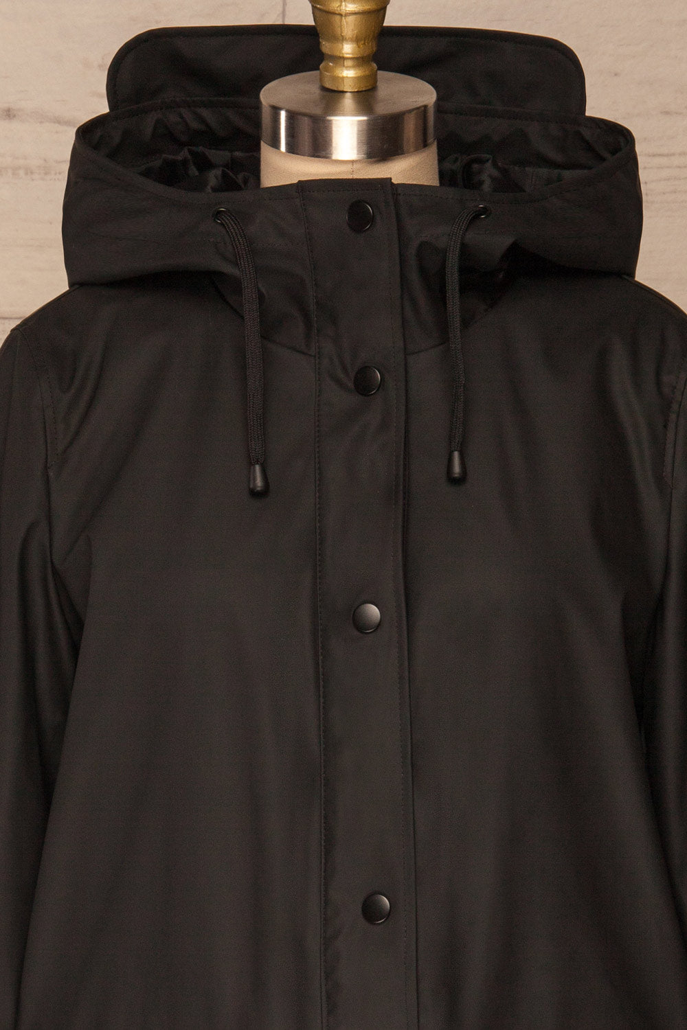 Klodzko Black Wide Hooded Rain Coat | La petite garçonne front close up