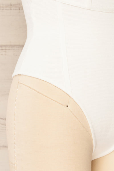 Leilani White Corset-Style Bodysuit | La petite garçonne side bottom close-up