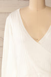 Lixa Ivory Orange Faux-Wrap Long Sleeve Top | La petite garçonne front close-up