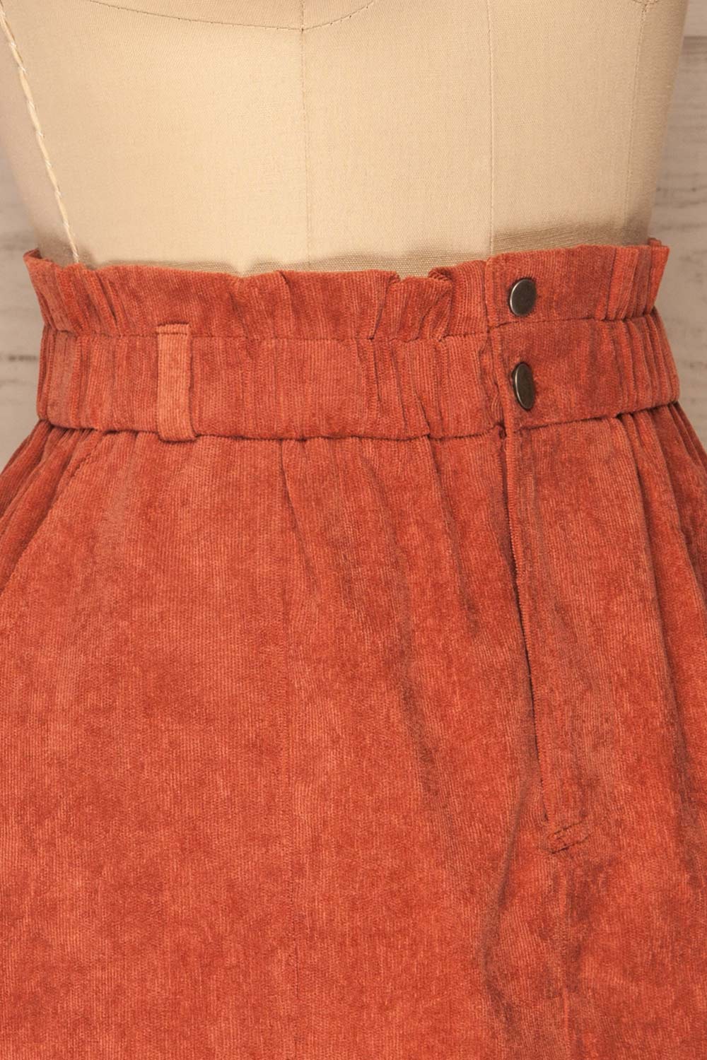 Loxley Clay Orange Corduroy Mini Skirt | La Petite Garçonne side close-up