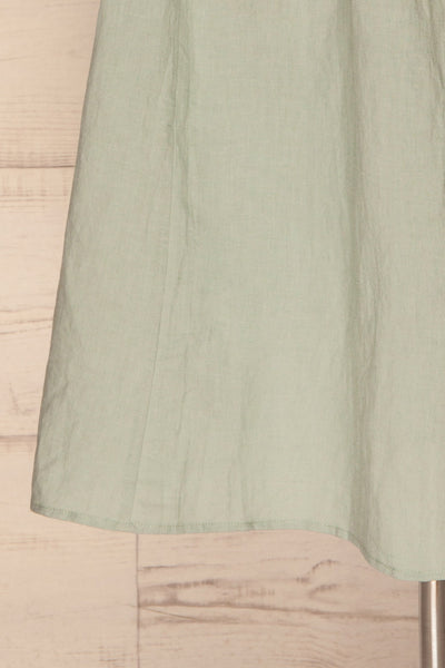 Lucani Blue-Green Faux-Wrap Midi Dress | La petite garçonne bottom close-up