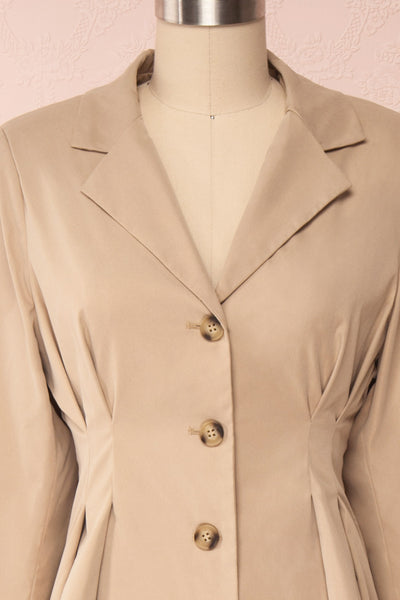 Maribelle Beige Long Sleeved Trench Coat | Boutique 1861 frontc close up