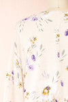 Mercy Beige 3/4 Sleeve V-Neck Floral Romper | Boutique 1861 back close-up