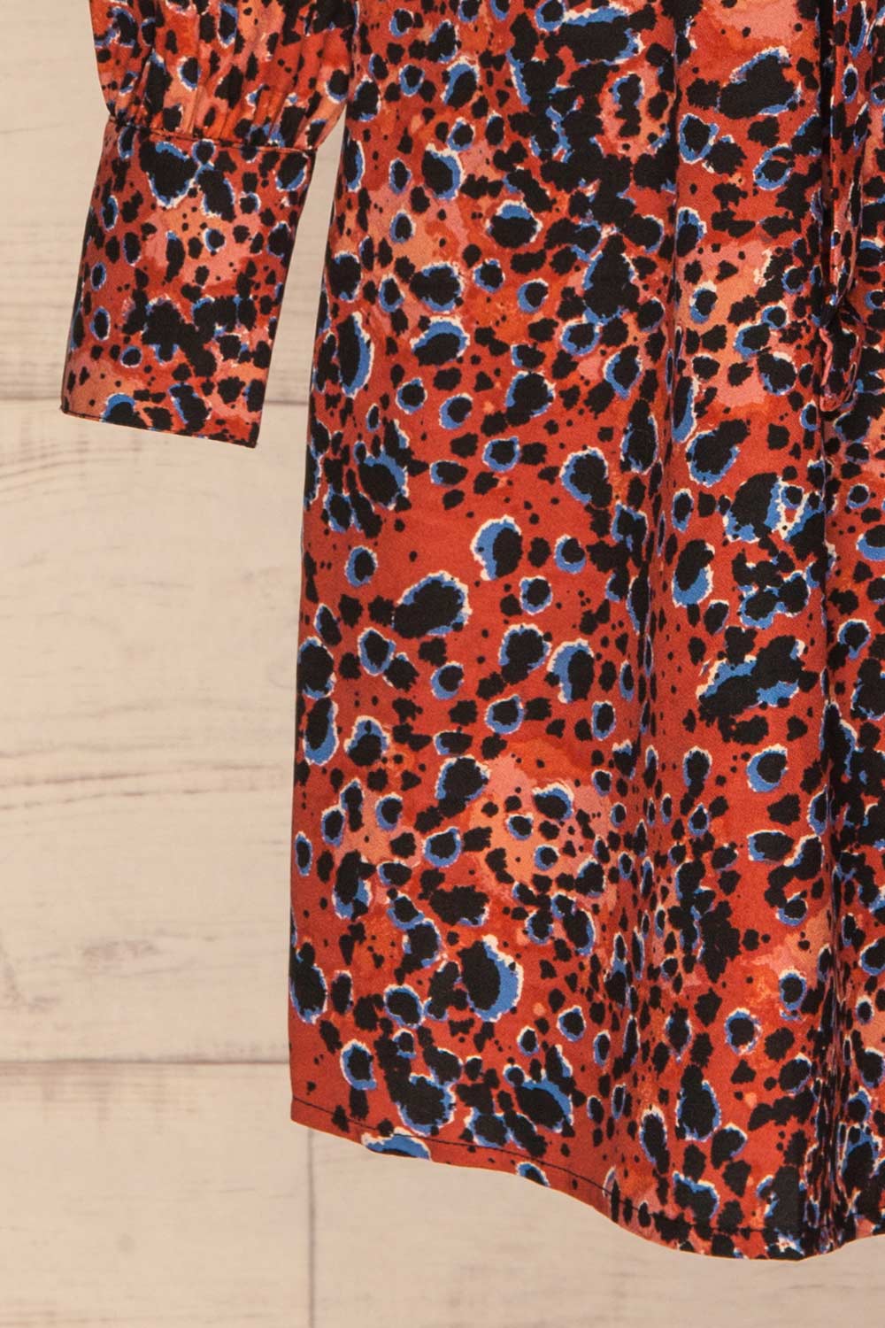 Nakhoda Rust Wrap Dress | Robe | La Petite Garçonne  bottom close-up