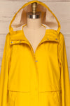 Oldham Yellow Matte Raincoat | La Petite Garçonne front close up hood