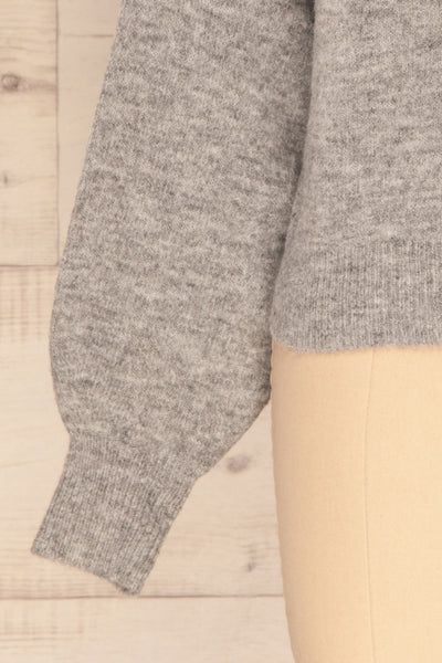 Oleksandra Grey Knit Sweater with Lace-Up Back | La Petite Garçonne bottom close-up