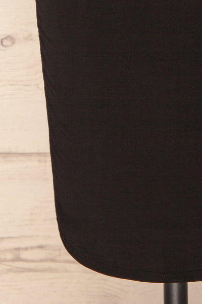 Phoebe Black Short Fitted Dress w/ V-Neck | La Petite Garçonne bottom close-up