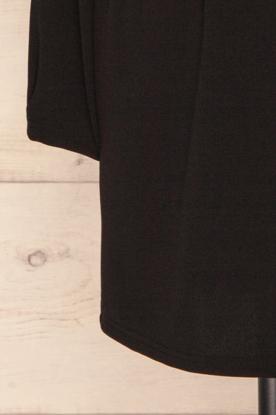 Plockton Black Long Sleeved Cocktail Dress | La Petite Garçonne bottom close up