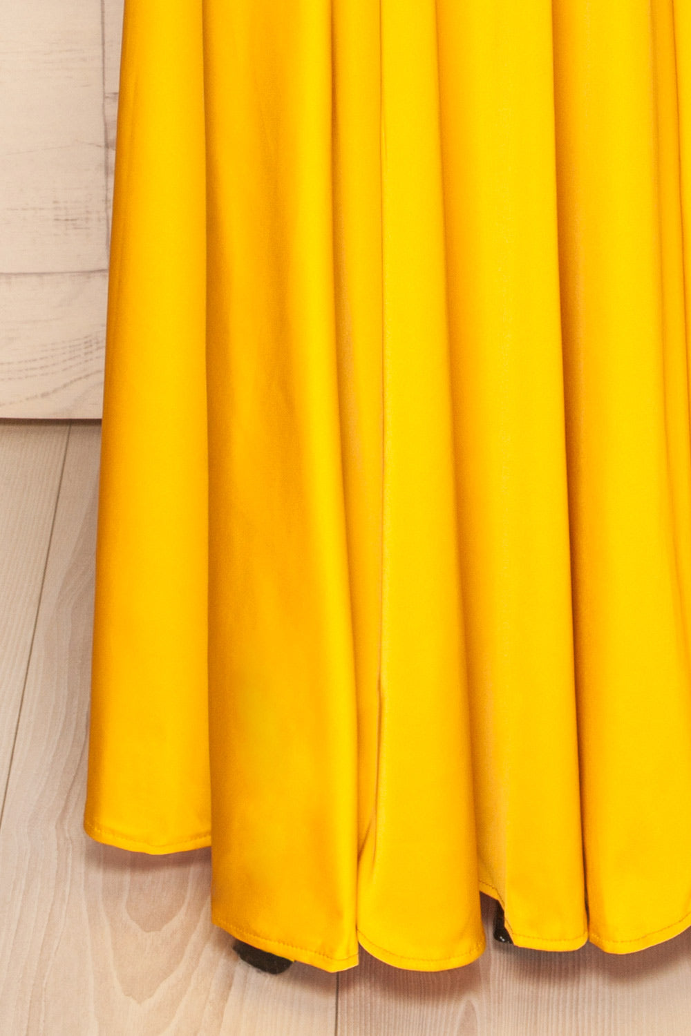 Roksem Jaune Yellow Satin A-Line Gown | La Petite Garçonne bottom close-up 