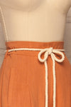 Rotello Orange High-Waisted Cropped Pants | La petite garçonne side close-up