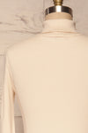 Roust Cream Cotton Ribbed Turtleneck Top back close up | La Petite Garçonne