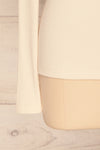 Roust Cream Cotton Ribbed Turtleneck Top sleeve close up | La Petite Garçonne