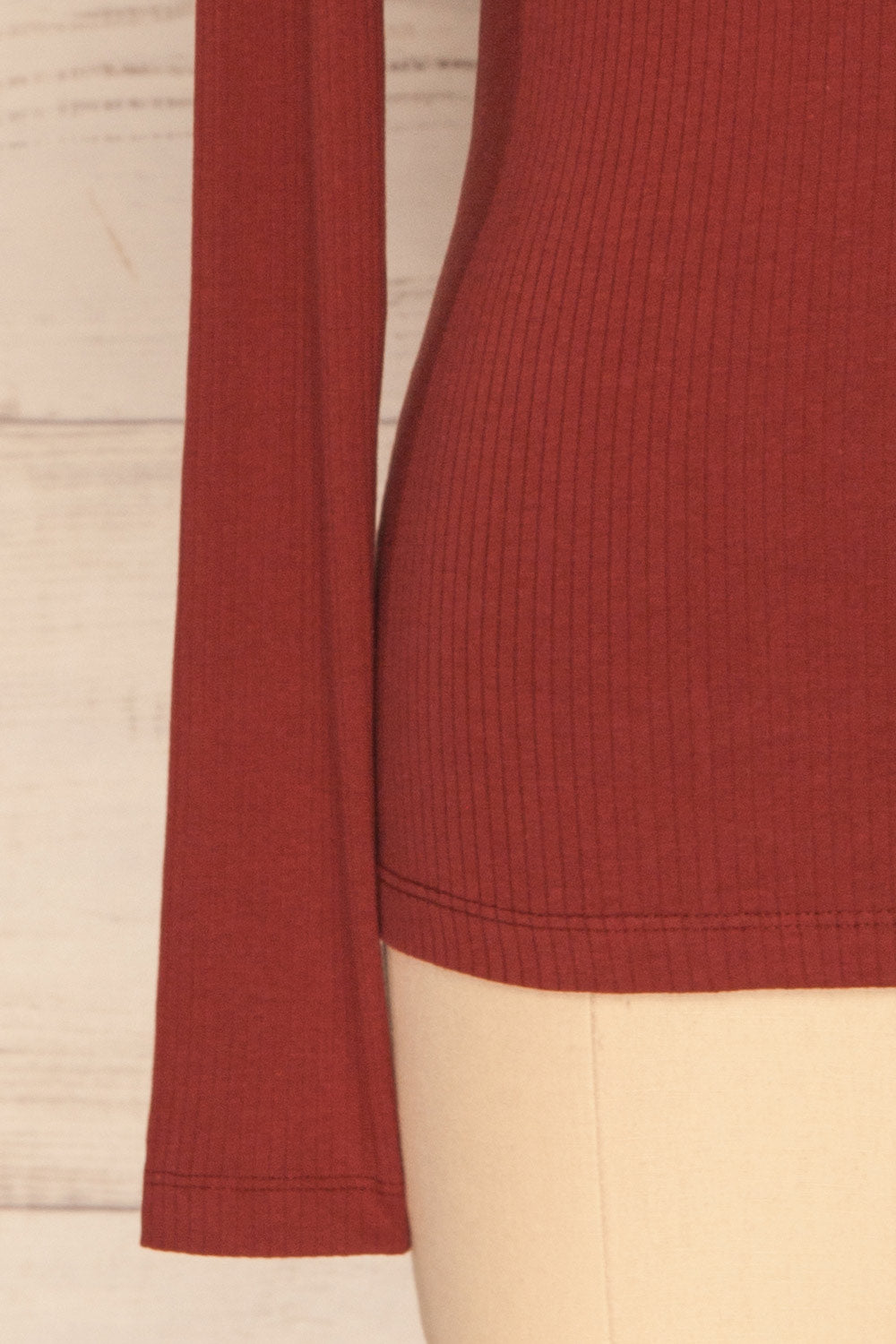 Roust Rust Cotton Ribbed Turtleneck Top sleeve close up | La Petite Garçonne