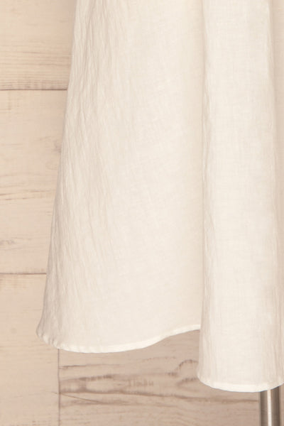 Valthi White Linen A-Line Midi Dress | La petite garçonne bottom close-up