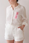Dunedin White High-Waisted Textured Shorts | La petite garçonne on model outfit