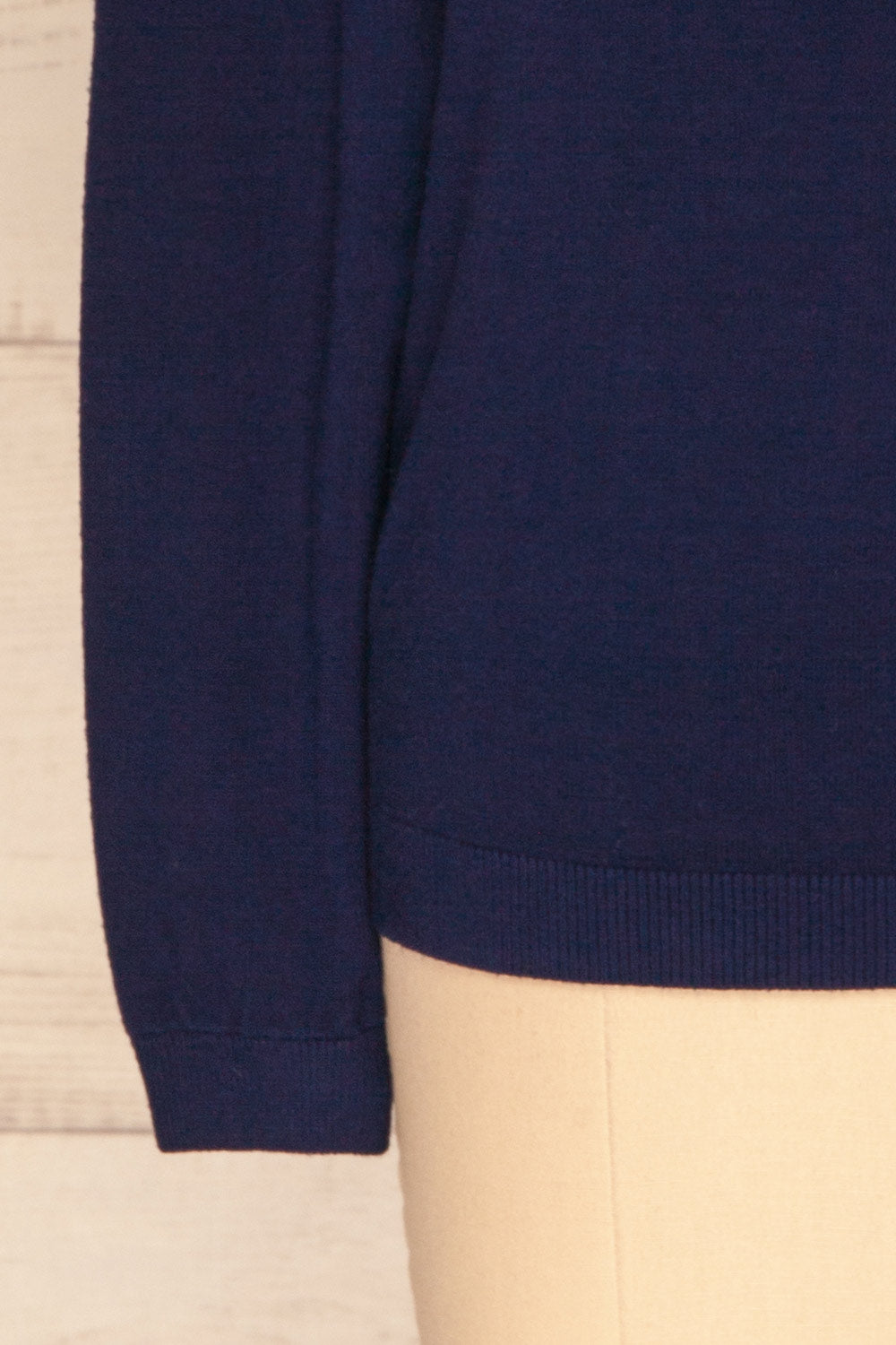 Yelysaveta Navy Blue Tied Neckline Knit Top | La Petite Garçonne bottom close-up