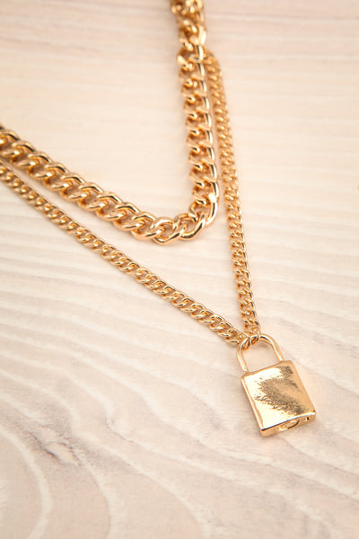 Acarus Or Gold Chain Necklace with Padlock flat lay | La Petite Garçonne