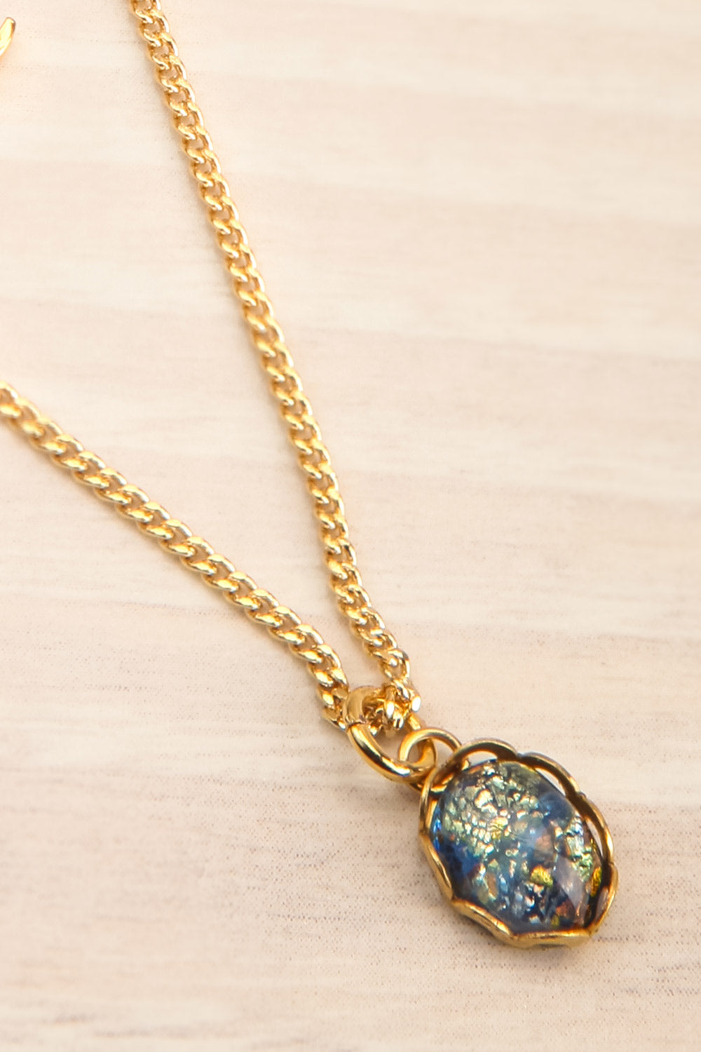 Ann Blyth Navy Gold Pendant Necklace | Boutique 1861 stone close-up