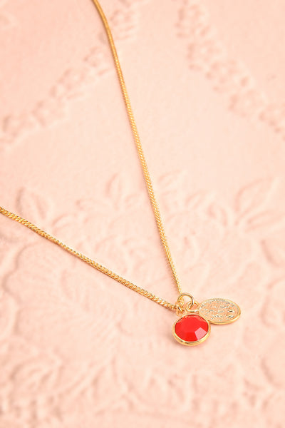 Anna Netrebko Red & Golden Pendant Necklace flat lay | Boutique 1861