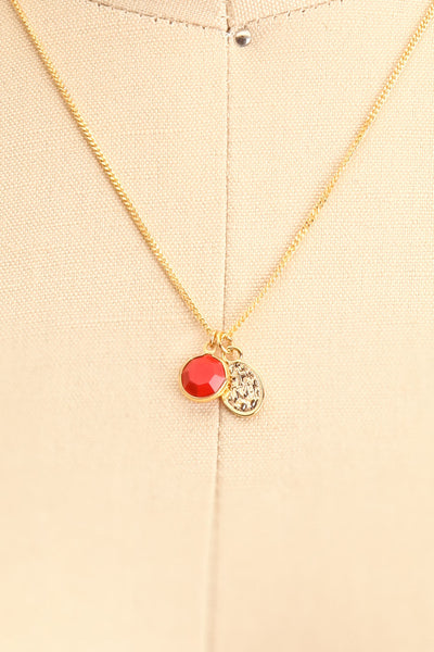 Anna Netrebko Red & Golden Pendant Necklace on mannequin close-up | Boutique 1861