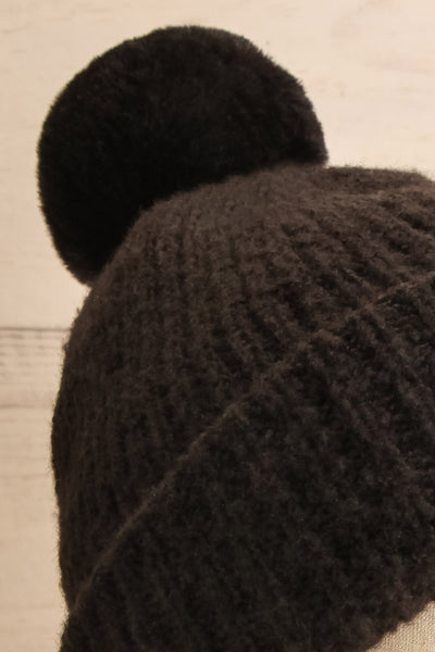 Apalda Noir Black Knit Tuque with Pompom on head close-up | La Petite Garçonne