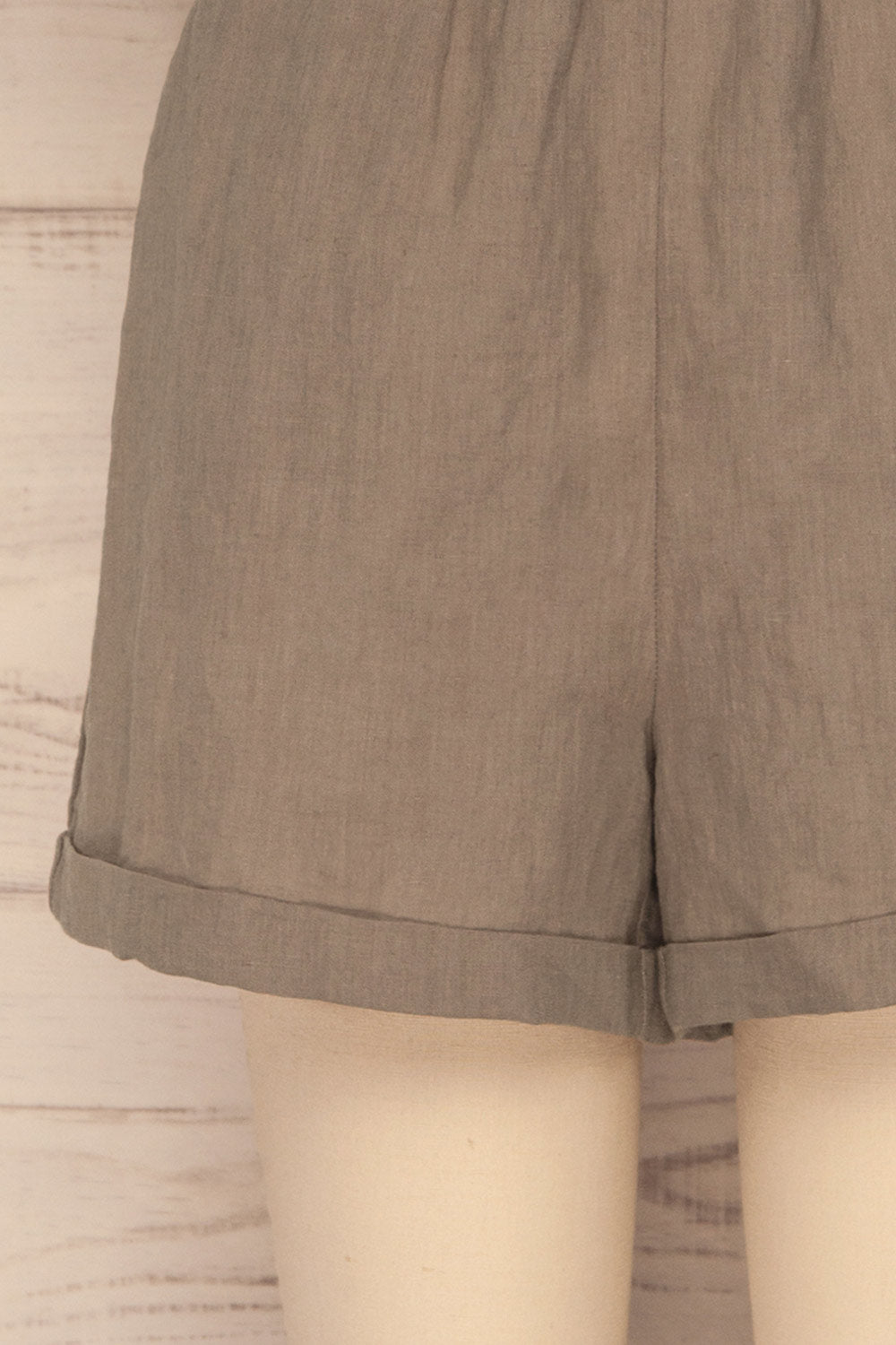 Arahal Taupe Short Sleeved Linen Romper | La petite garçonne bottom close-up