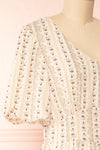 Assoura Cream Puffy Sleeve Floral Maxi Dress | Boutique 1861 side close-up
