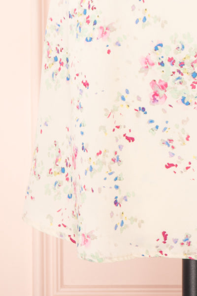 Aymara Off-White Floral Short Sleeve Wrap Dress | Boutique 1861 bottom close-up