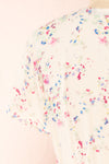 Aymara Off-White Floral Short Sleeve Wrap Dress | Boutique 1861 back close-up