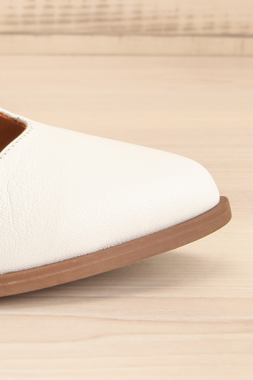 Bruca White Pointed Toe Asymmetrical Flats | La petite garçonne side front close-up
