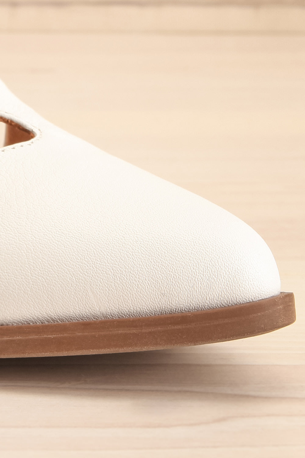 Bruca White Pointed Toe Asymmetrical Flats | La petite garçonne front close-up