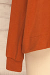 Cascajo Clay Burnt Orange Long Sleeved Top | La Petite Garçonne bottom close-up