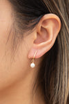 Charline Pearl Golden Pendant Earrings | Boutique 1861 on model