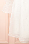 Darlene Short White A-Line Dress w/ Pearls | Boutique 1861 bottom close-up