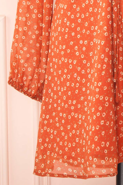 Everly Short Orange Dress w/ Long-sleeves | Boutique 1861 bottom close-up