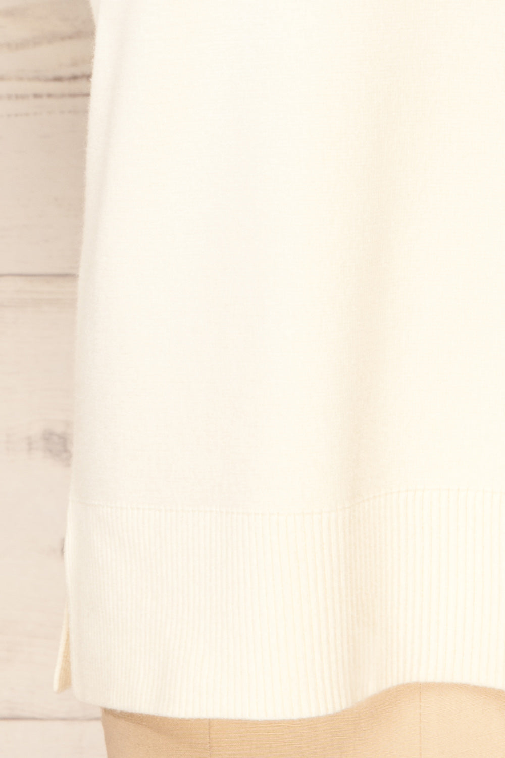 Ferrol Ivory Sleeveless Knit Vest | La petite garçonne bottom close-up