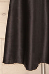 Glyfada Black Silky Midi Skirt bottom close up | La Petite Garçonne