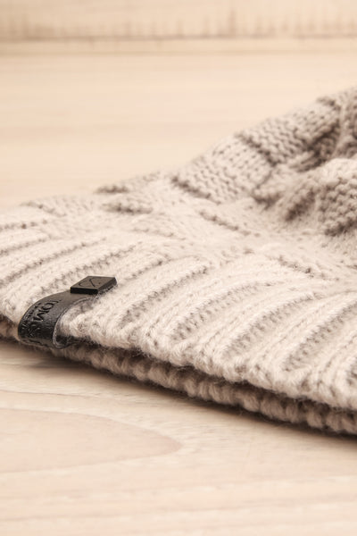 Honokaa Beige Knit Tuque with Faux-Fur Pompom flat close-up | La Petite Garçonne